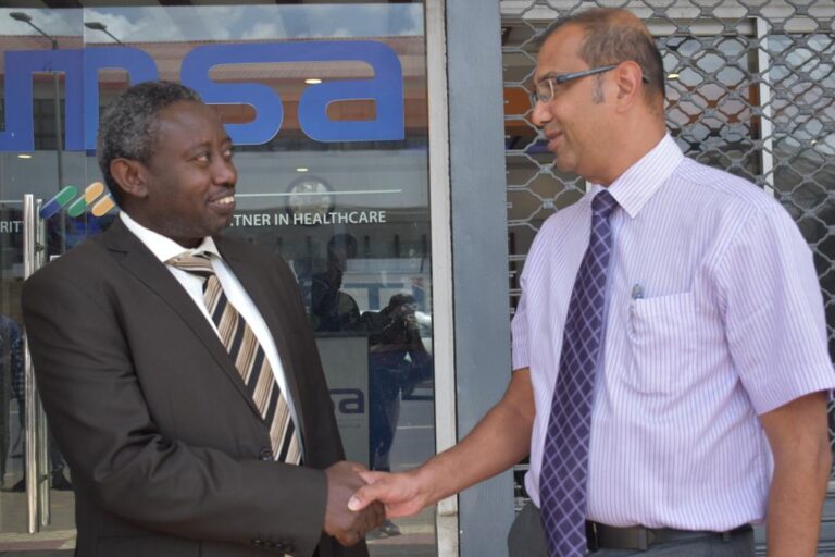 KEMSA acting CEO John Kabuchi with Federation of Kenya Pharmaceutical Manufacturers (FKPM) Chairperson Rohin Vora