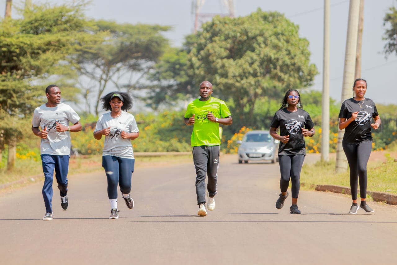 The founder and CEO of Africa Feature Network, Peter Aowa (centre), leads members of the secretariat shortly after the press conference at Moi International Sports Centre Kasarani// Photo : Humfrey Onyala.