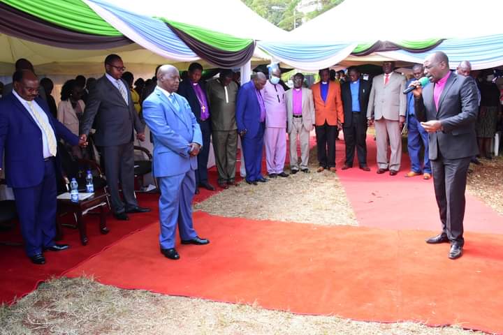 Bishop Wanjohi (right) of New Life Church, Nyeri leading prayers when Nyeri County governor Mwalimu Mutahi Kahiga(in blue suit) met his workers yesterday.