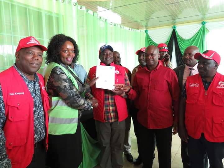 Kirinyaga County gubernatorial candidate for Jubilee party Charles Kibiru (3rd left) and his deputy Peter Ndambiri (2nd right) after they were cleared to contest the seat.
