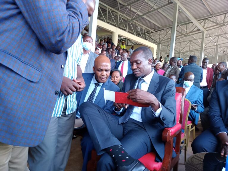 Kisii county governor Simba Arati counter checking driving licence