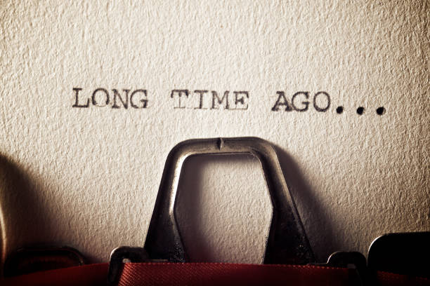 The sentence, long time ago, written with a typewriter.