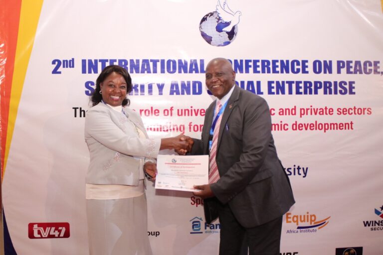 MKU Co-founder Dr Jane Nyutu issues Certificates to delegates who attended the 2nd international conference on peace, security and social enterprise at MKU