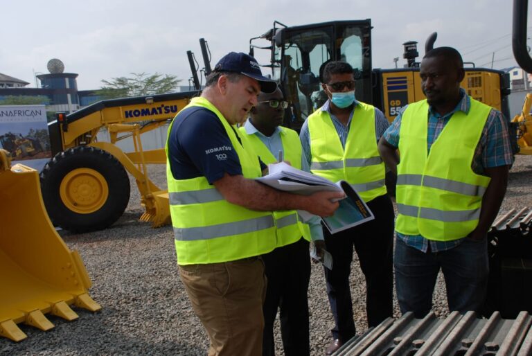 Panafrican Equipment Group Sales Manager Philip Stander (left) explains the features of the Komatsu GD555 motor grader to Engineer Benedict Mutunga of the Ministry of Transport, and Infrastructure (second left), AK Mohamed of Transnile Enterprises and Gerald Mbugua of Pemorald Enterprises during the launch of the new equipment at the company’s Mombasa Road premises