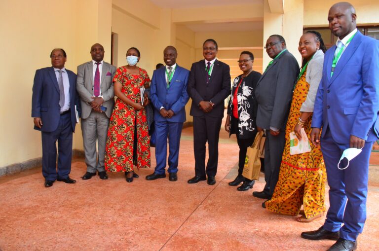 PS state department for university education Amb. Simon Nabukwesi (black suit) pause for a photo with Meru university council