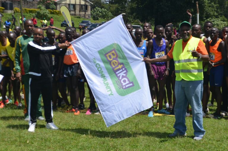 Betika's Baranding and Marketing Manager Erick Mwithi with Kericho Athletic officials