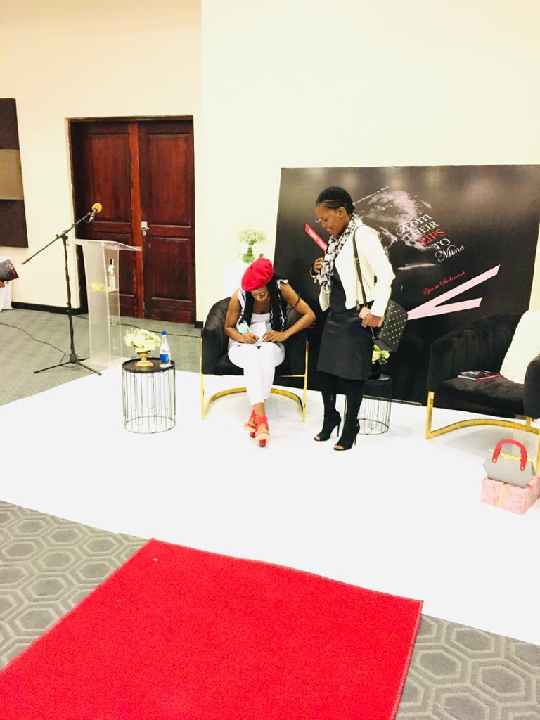 Gaone writing Paula an autograph..