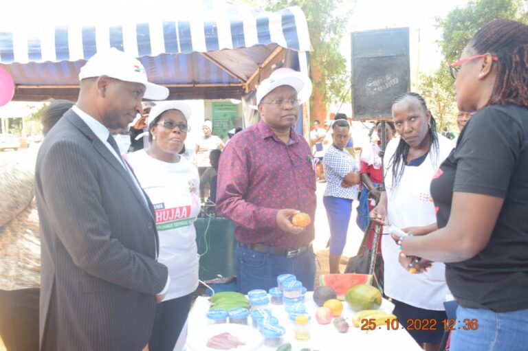 Nyeri County Ag. CEC in charge of Health Services Robert Thuo (centre) being taken through items on display at Mukurwe-ini Hospital grounds during the launch of World Breast Cancer month yesterday