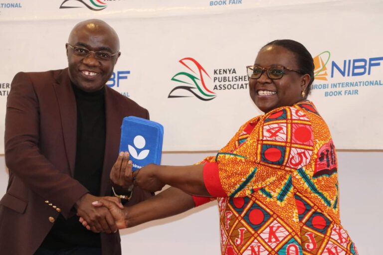 Worldreader Regional Manager East Africa Joan Mwachi presents a donation