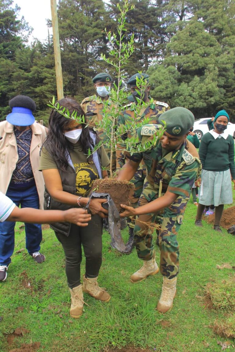 Evelyn Kimathi CEO of Dedan Kimathi Foundation with The Chief Conservator of Forests Julius Kamau planting a tree