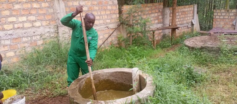Nicholas Ondicho on his farm at Mosocho preparing Biogas