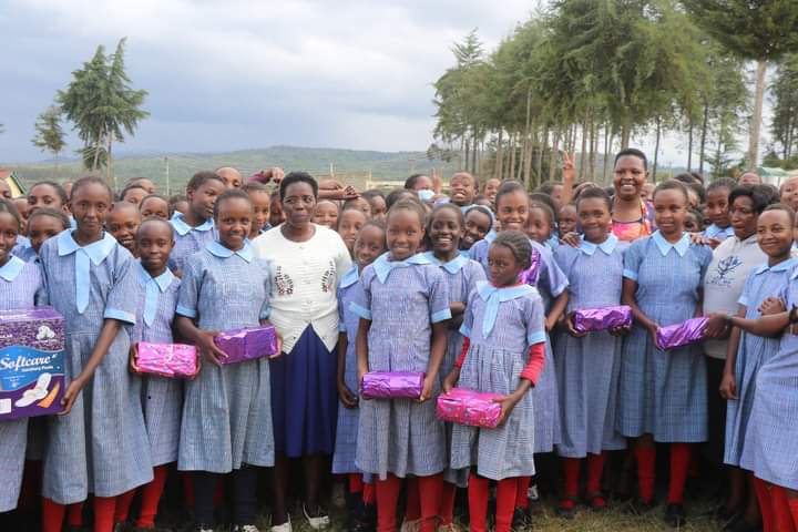 Nyandarua County First Lady Grace Kiarie with some of the adolescent girls who have so far benefited from her hygienic kits.