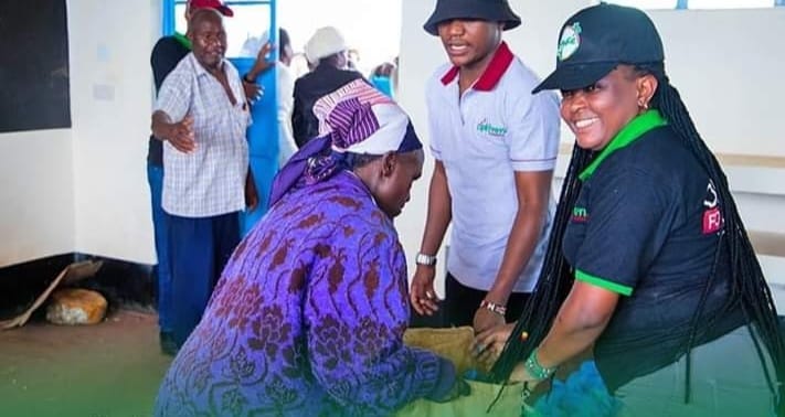 Staff from Optiven Foundation at Labbura in Kieni constituency when the organisation donated relief supplies to the locals.