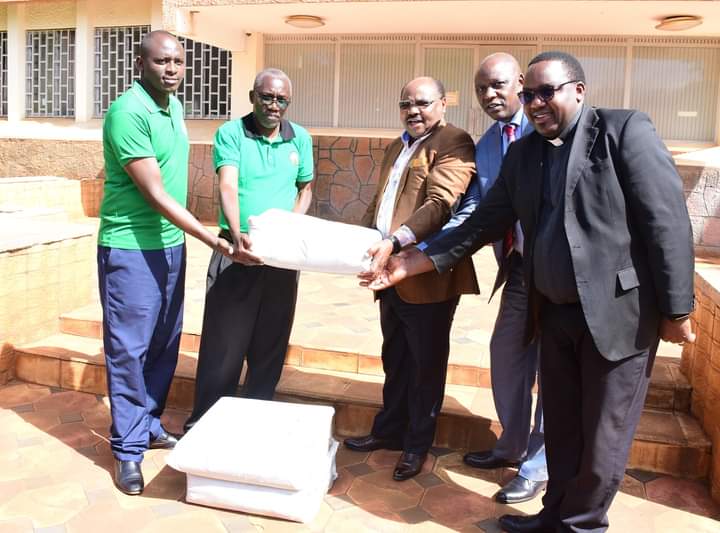 Nyeri County Deputy Governor David Kinaniri (3rd right) receiving potting bags yesterday