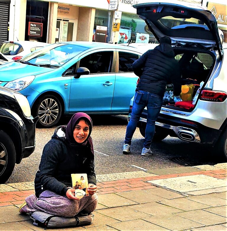 Photo 1 Tale of haves and have-nots... A mother on a street in London begging for money to buy food for her children and a shopper loading car with his purchases. Photo Copyright SHAMLAL PURI