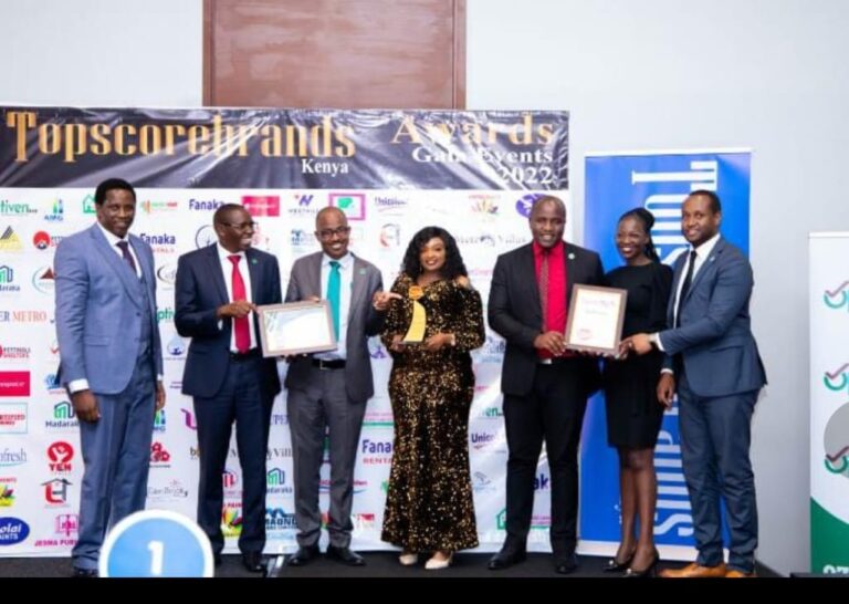 Topscore Brands officials with top winner, Optiven Real Estate CEO George Wachiuri and other winners during the 3rd Gala Awards ceremony at Radisson Blu Hotel.