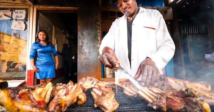 A butcher preparing roast meat