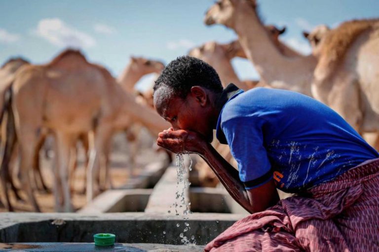 A man in drought drinking water