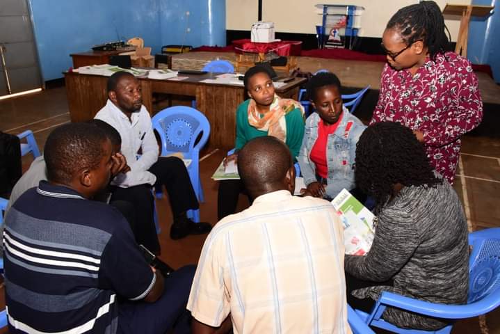 Ms Reginah Wanjiru Macharia (standing) explaining a point in a group discussion the Nyeri County Integrated Development Plan forum yesterday.
