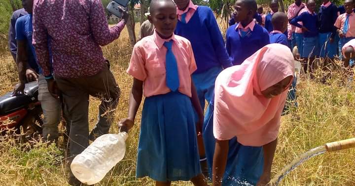 Pupils from one of the beneficiary institutions drawing water
