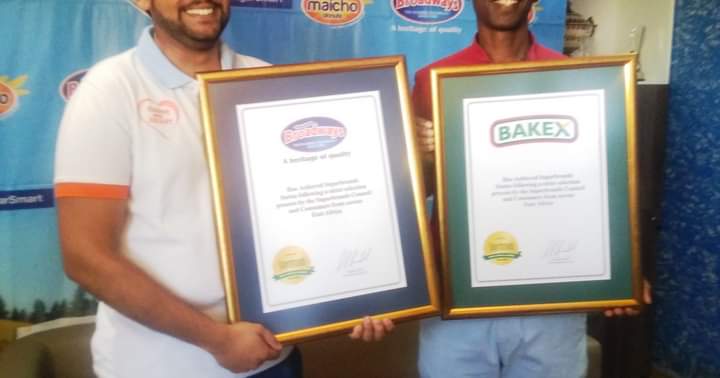 Staff holding the award certificates