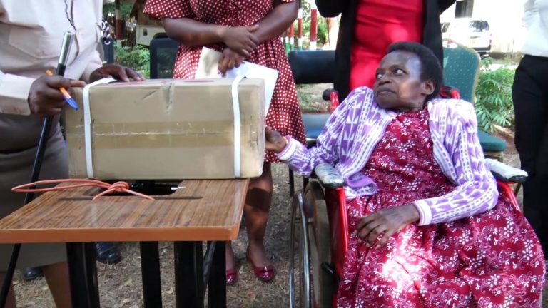 A PWD beneficiary receives tools of trade from NFDK