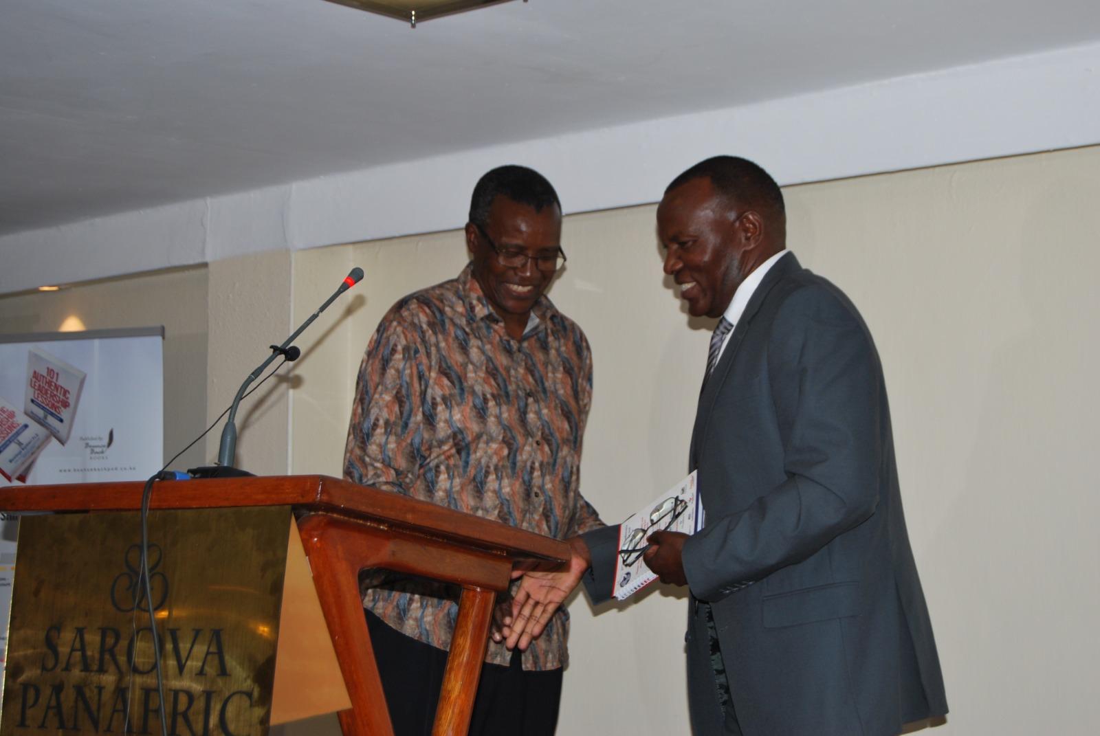Dr.Vincent Gaitho, Pro Chancellor MKu (left) with CJ Emeritus David Maraga, chief guest during the launch of the book