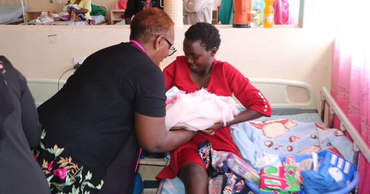 Kirinyaga County CEC for Gender Millicent Nyawira gifting a new mother