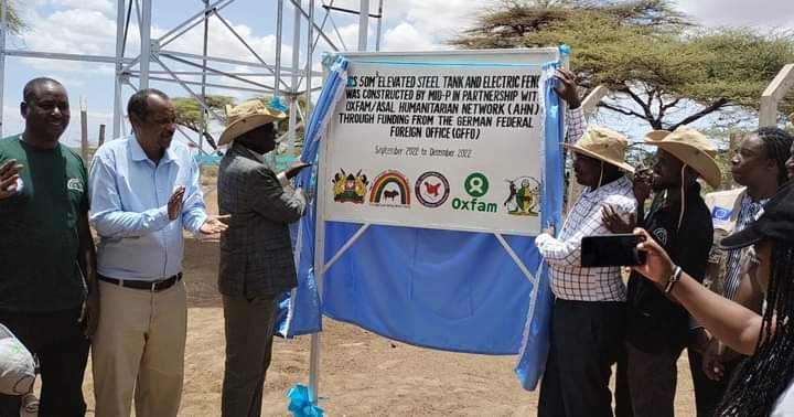 Robert Ngakutan, the Community Water Project Manager with other officials and local residents during commissioning of the borehole