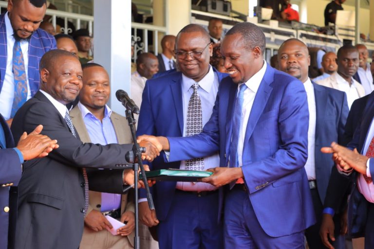 The Task Force committee, chair Quantity Surveyor, Haroun Nyakundi handing over the report to Kisii County Governor Simba Arati at Gusii Stadium