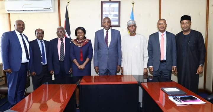 Cabinet Secretary Ezekiel Machogu posing for a photo with the visiting Nigerian delegation