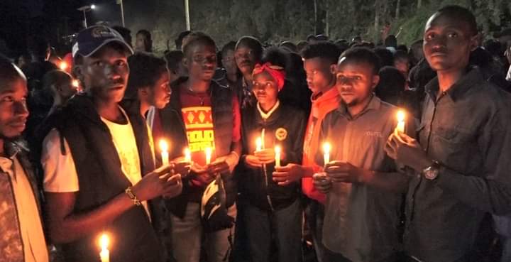 Embu students holding candles