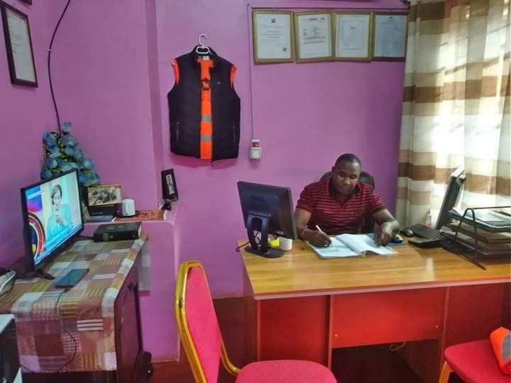 Jonah Waweru Kamau, the Director, Lions Security Limited in his office