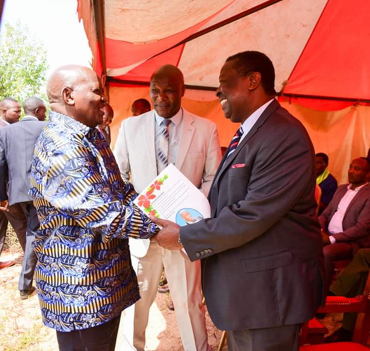 Prime Cabinet Secretary Musalia Mudavadi (right) being welcomed by Nyeri County governor Mutahi Kahiga (left)