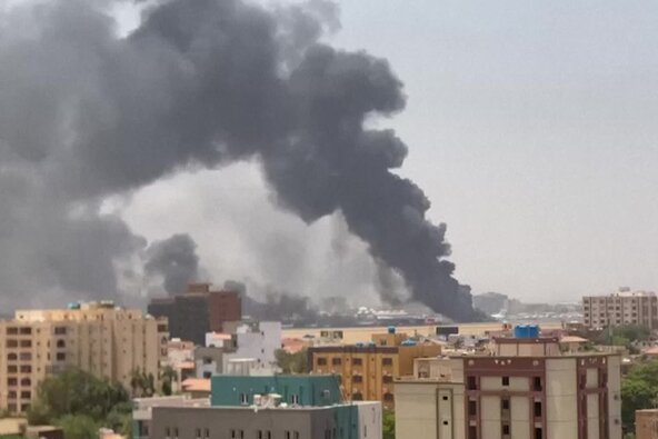 Smoke rises from a neighbourhood in Khartoum