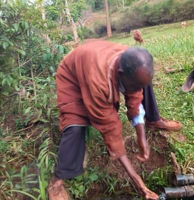 Environmentalist Peter Wamui showing a never drying river