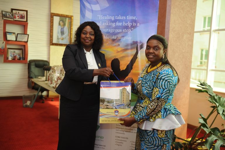 MKU Co-founder Dr Jane Nyutu(left) presents a gift to Pastor Dr. Dorcas Gachagua after the event.