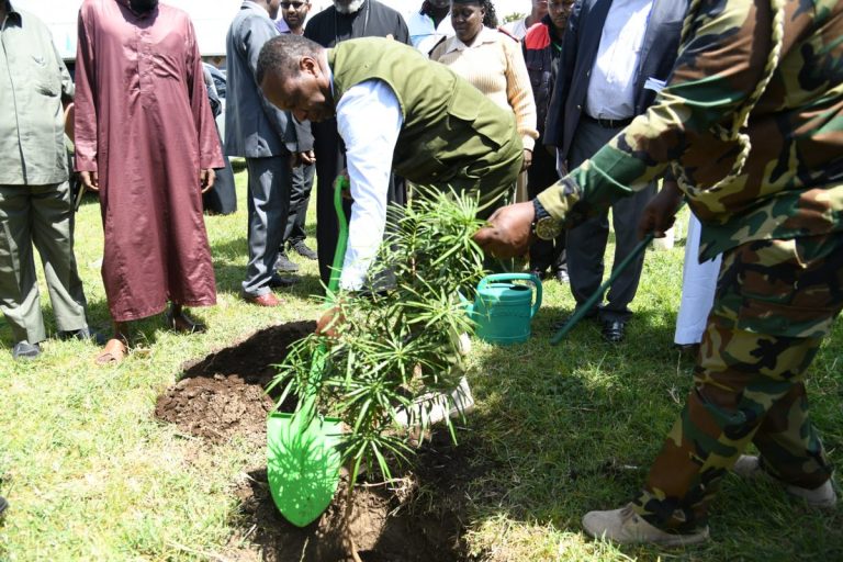 PS Gitonga Mugambi planting a commemorative tree