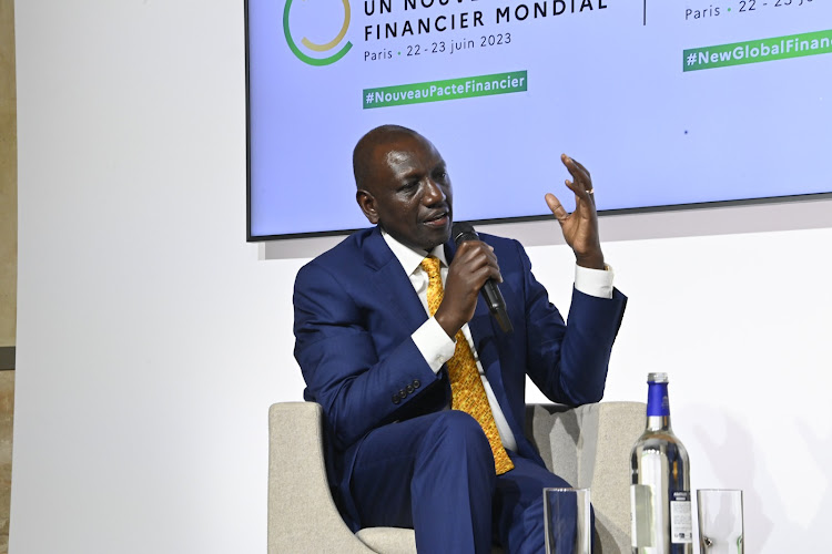 President William Ruto speaking to other leaders during a roundtable meeting in Paris on June 22
