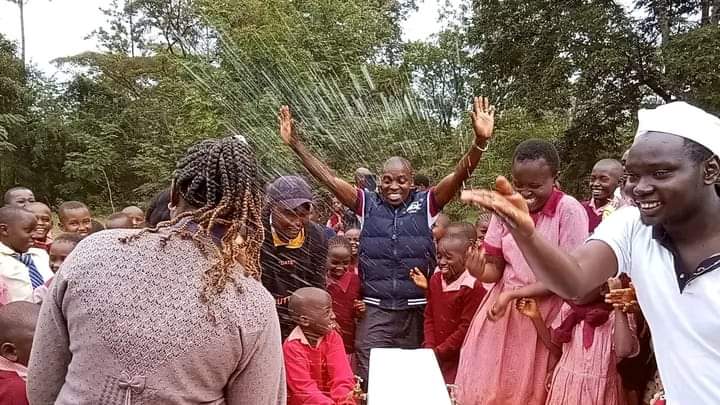 Karanja Mburu Wamatangi being welcomed at Rurii Primary School