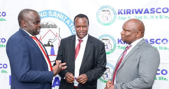 Kiriwasco Board Chairman James Kihia in discussion with other officials