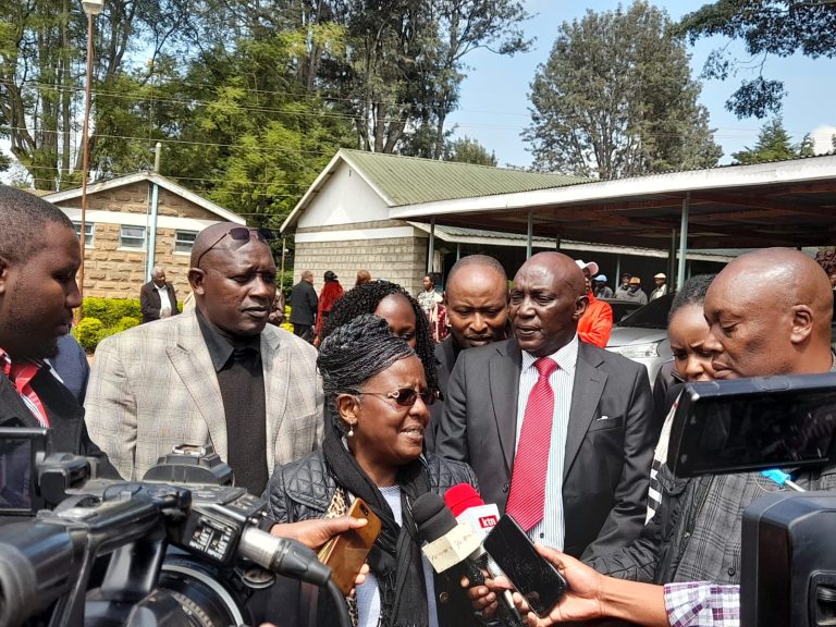 National Land Commission's Esther Murugi addressing the media after meeting Wambugu Farm beneficiaries