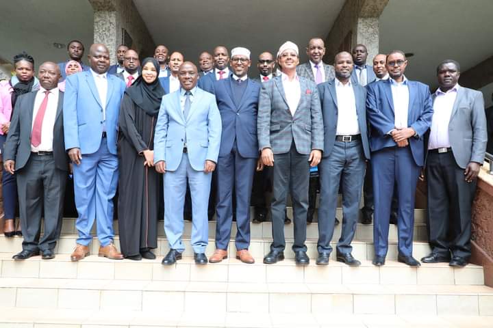 Senior Ministry of Water, Sanitation and Irrigation officials pose for a photograph with Wajir County leadership outside the ministry headquarters after a consultative meeting yesterday