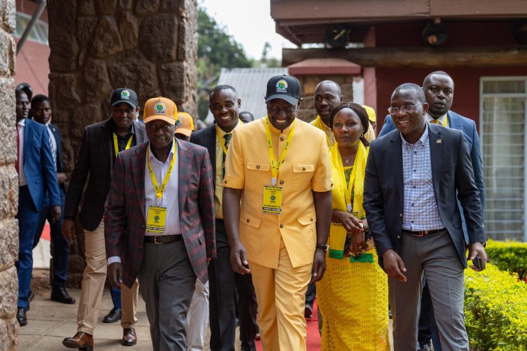 President Dr William Ruto (in kaunda suit) and his deputy Rigathi Gachagua (L) at Bomas