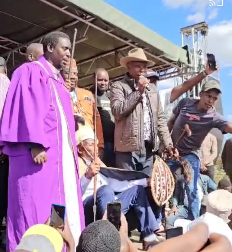 Dr. Thuo Mathenge seated and Maina Njenga holding mic during Mathenge’s installation as patron