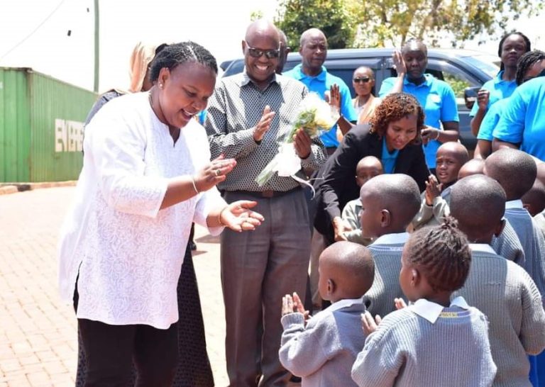 Labour CS Ms Florence Bore (left) interacting with children at Murang’a Child Rescue Centre on Friday.