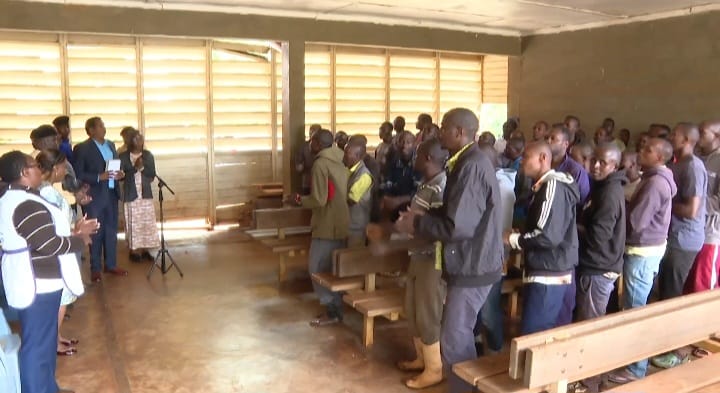 Some of the youth join Pastor Dorcas and other guests in a praise and worship hymn.
