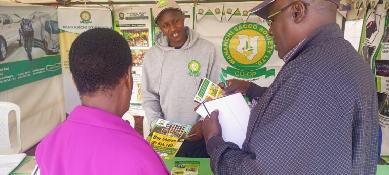 Charles Mutiga, an Assistant Marketing Manager at Wanainchi Sacco Society explaining some of the services they offer to coffee farmers.