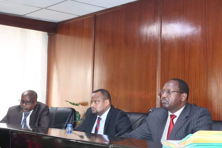 Dr John Mutunga (right) with other committee members during yesterday's session