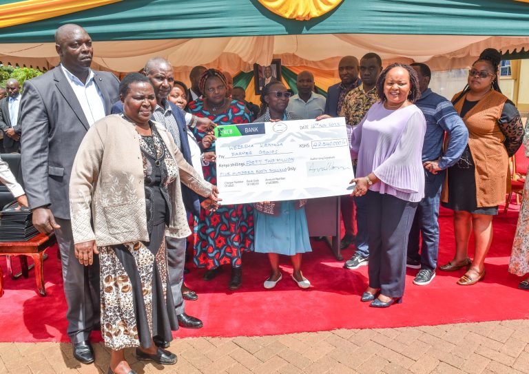 Kirinyaga County governor Ann Waiguru pose for a photo with beneficiaries